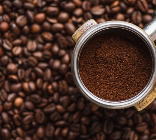 top-view-of-ground-coffee-in-portafilter-on-coffee-2022-12-16-17-42-52-utc (1)